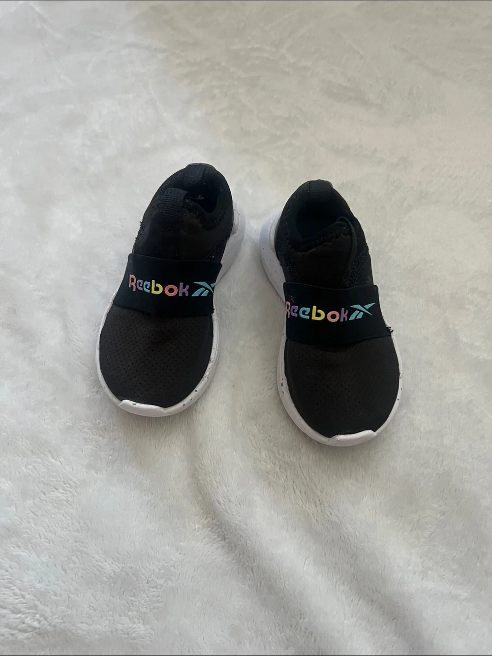 Reebok Kids Black Slip-On Sneakers with Rainbow Logo Accent